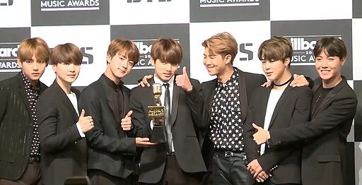BTS speaking at a press conference during the Billboard Music Awards in 2017