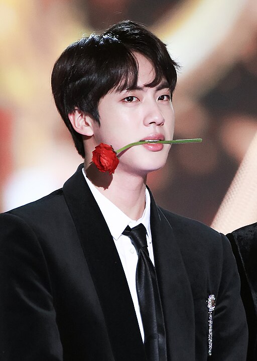 BTS’s Jin speaking at a press event in 2018