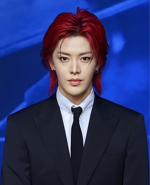 Yuta of NCT at an event in 2023, wearing a light denim jacket