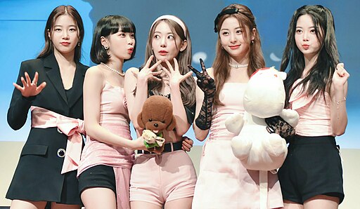 LE SSERAFIM posing together at a fan signing event