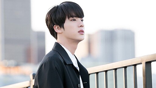 Jin of BTS posing during a 2018 LA photoshoot for BTS’s 5th anniversary