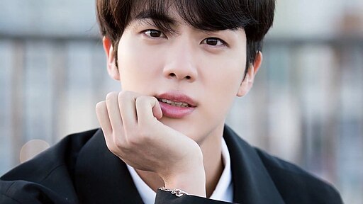 Jin posing during a BTS photoshoot in Los Angeles in 2018