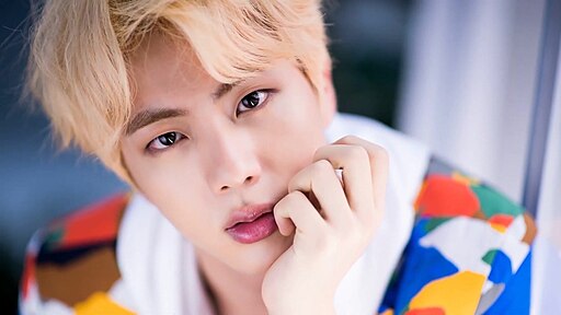 Jin of BTS posing during the “Idol” MV set photoshoot in July 2018