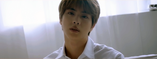 Jin of BTS posing for VT Cosmetics L’Atelier Perfume campaign in 2019