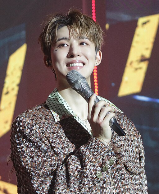 B.I performing on stage during the 2022 'All Day Show' in Seoul.