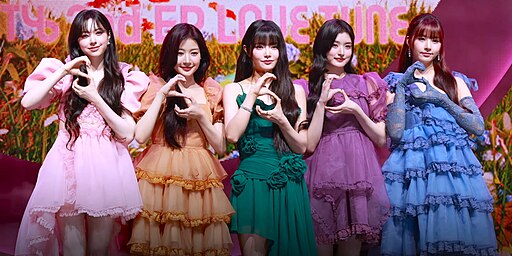 FIFTY FIFTY performing at their 'Love Tune' showcase, radiating stage charisma.