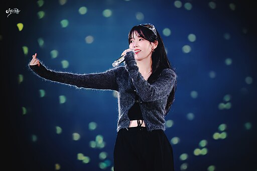 IU performing at her ‘I＋UN1VER5E’ fan concert, 2023.