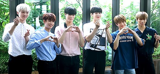 ASTRO members posing at a public event in 2017