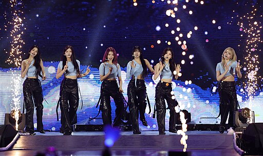 IVE performing live at the 2023 World Scout Jamboree K-POP Super Live Concert, showcasing their energetic stage presence.