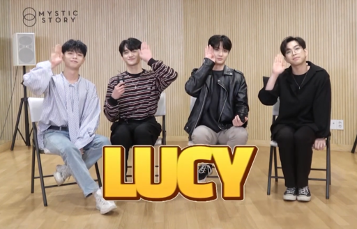LUCY posing as a group in promotional outfits