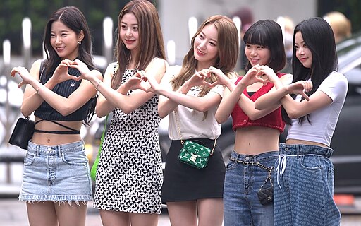 LE SSERAFIM during Music Bank appearance, captured in vibrant stage outfits