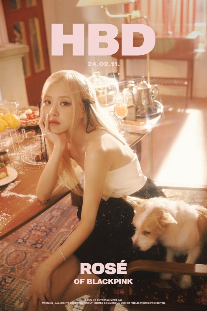 BLACKPINK’s Rosé posing at a birthday-themed photoshoot with her dog, shared for her 2024 birthday on Weverse
