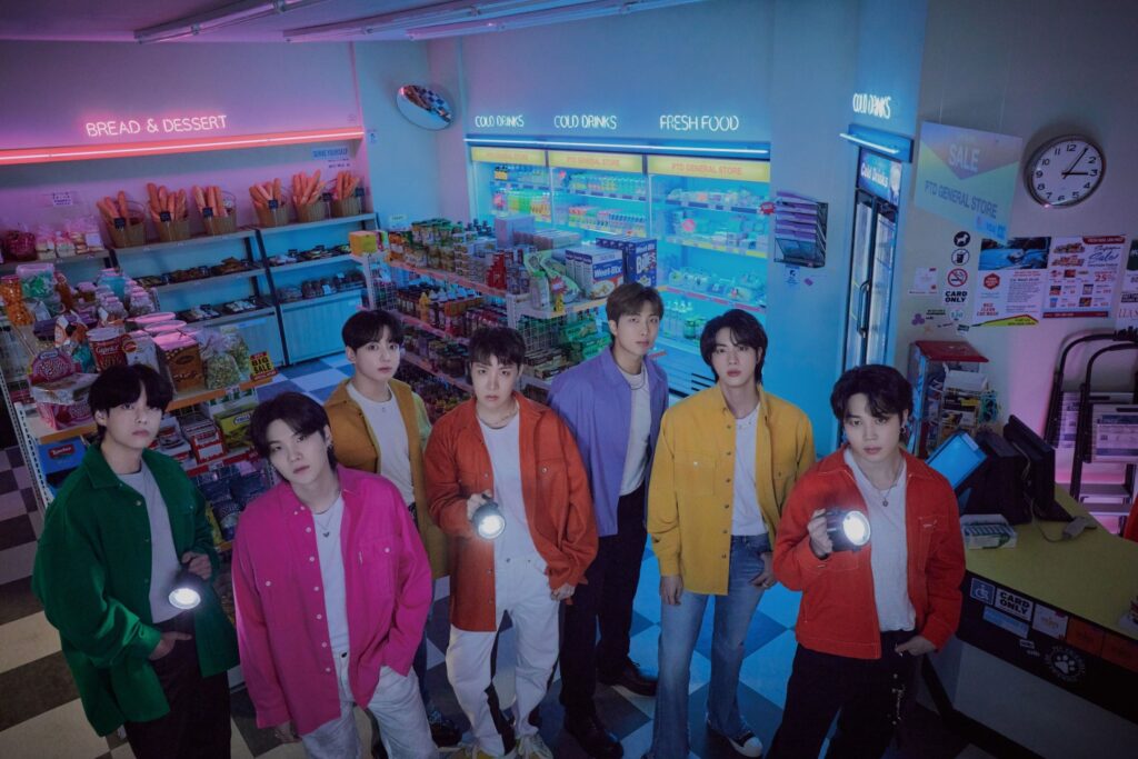 BTS members inside a convenience store set for the ‘Permission to Dance On Stage – LIVE’ Connect concept photo